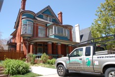 Victorian house with landscaping and truck Denver painting company