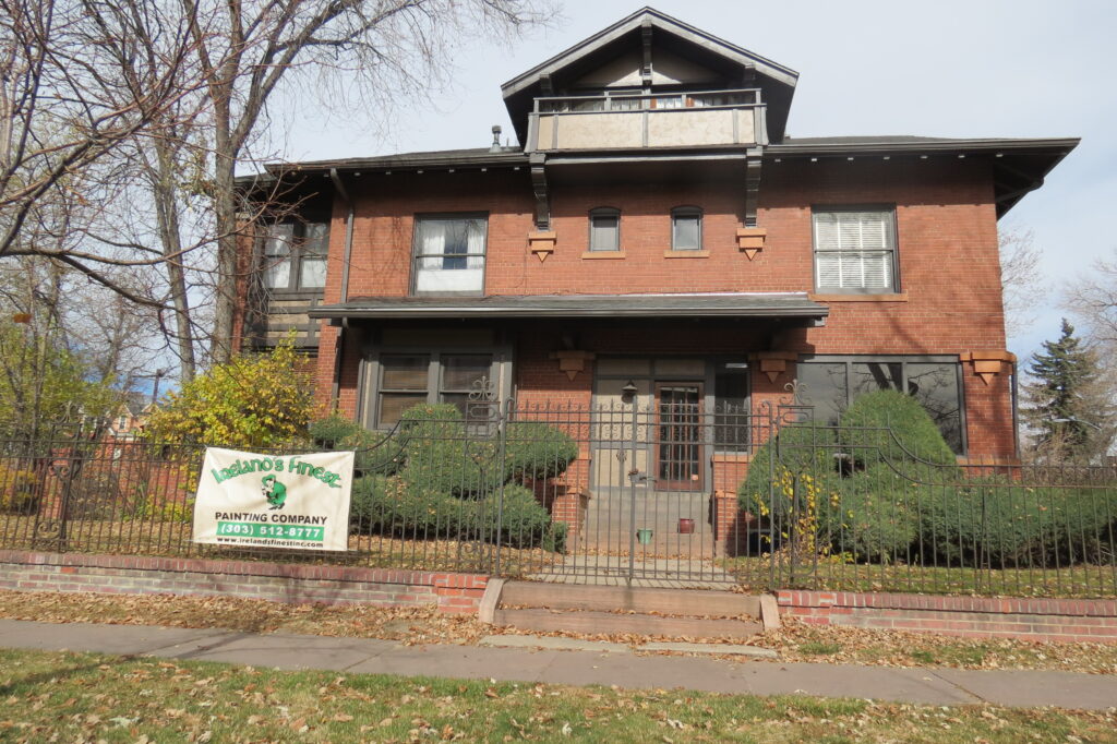 Historic brick house with fence Historical Denver Painting Services