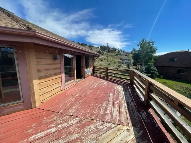 Old faded deck before. Needs deck painting services